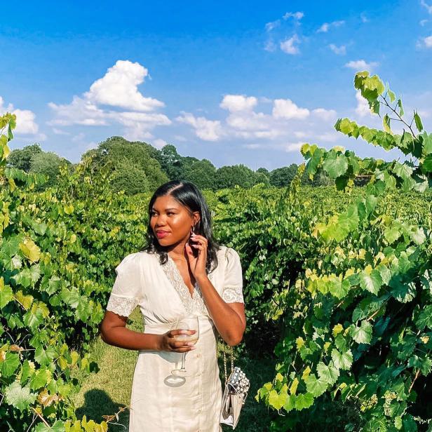 Woman in the vineyards at Chateau Elan Winery & Resort in Braselton, Georgia. Photo by @jessicahambrick