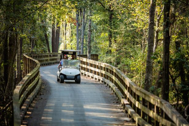 Couple on a golf cart at Brazell's Creek Golf Course at Jack Hill State Park in Reidsville, Georgia