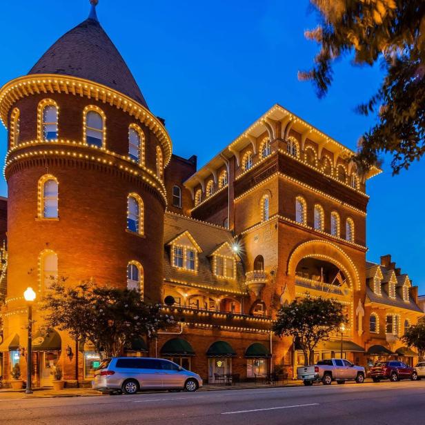 Exterior nighttime view of The Windsor Hotel in Americus, Georgia