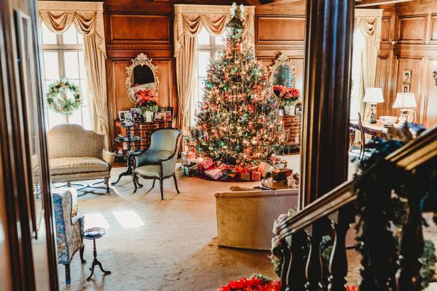 A Christmas tree and decoations inside a historic home.