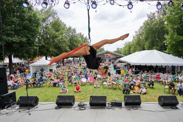 Performer on stage at the Arts in the Heart of Augusta Festival