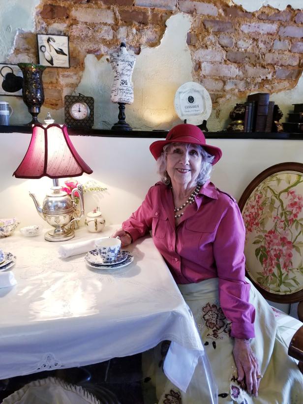Woman having tea at Fergusson's on the Square in Hoschton, Georgia