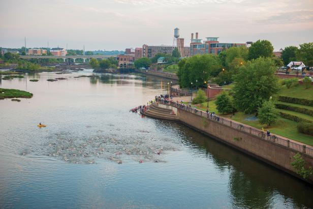 Triathletes swimming in the Chattahoochee River in Columbus, Georgia