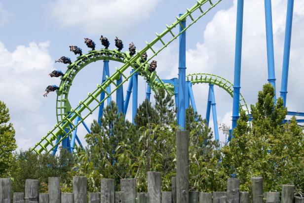 A giant roller-coaster track twists through the sky