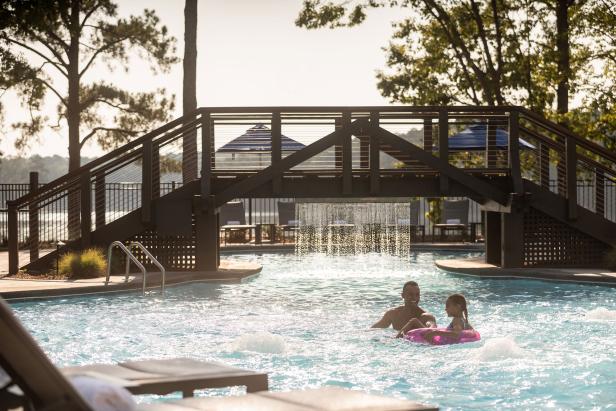 Father and daughter swimming at Ritz-Carlton Reynolds, Lake Oconee in Greensboro, Georgia