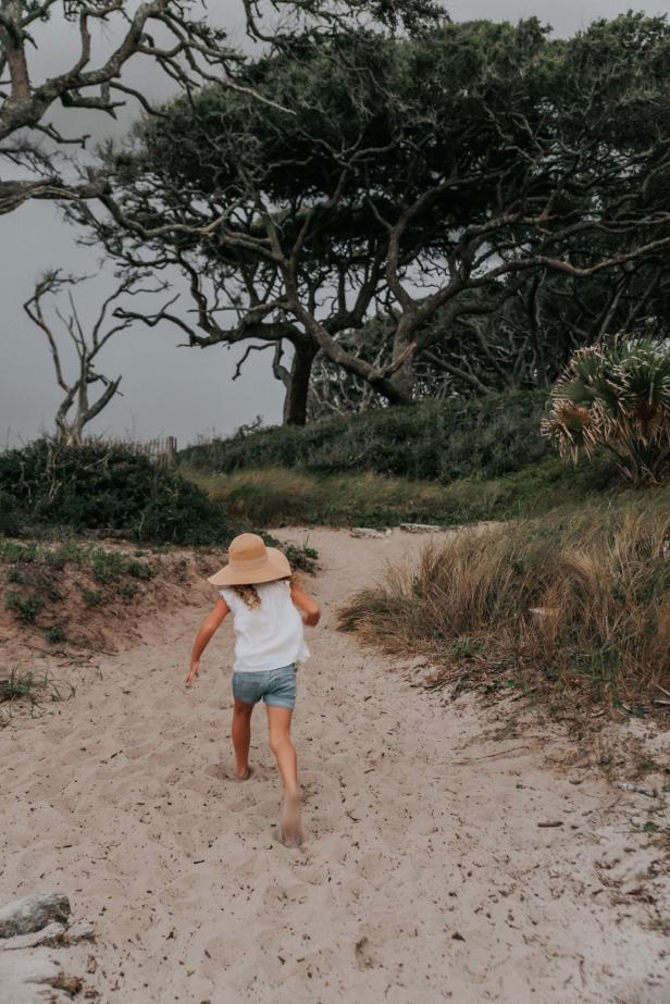 Girl on trail to the beach on St. Simons Island, Georgia