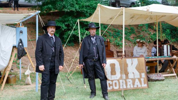 Two men wearing all black posing as Doc Holliday in Griffin, Georgia.