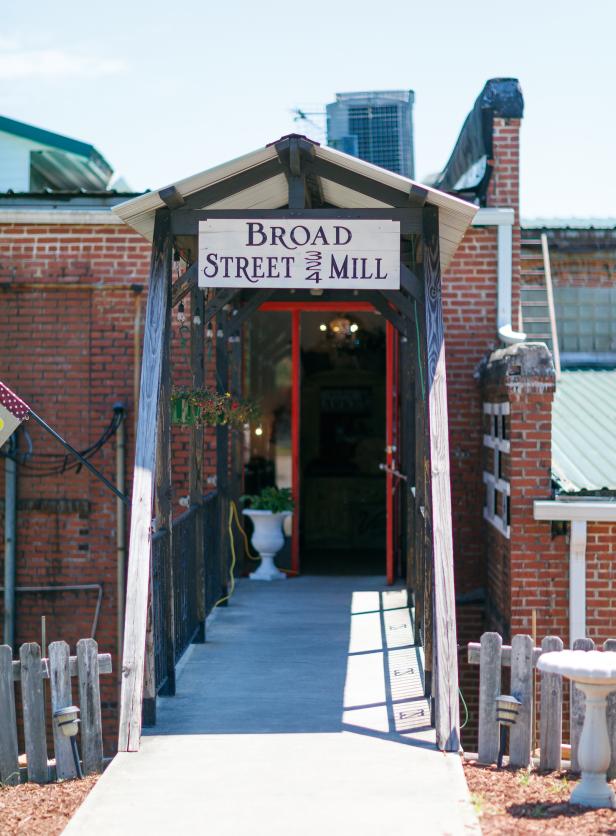 Exterior front view of the walkway leading up to the Broad Street Mill Marketplace in Griffin, Georgia.