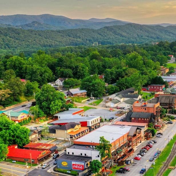 Aerial view of a downtown with mountains in the background