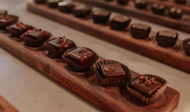 A row of chocolate-covered truffles