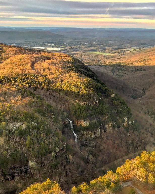 Aerial view from a helicopter tour over colorful mountains in fall.