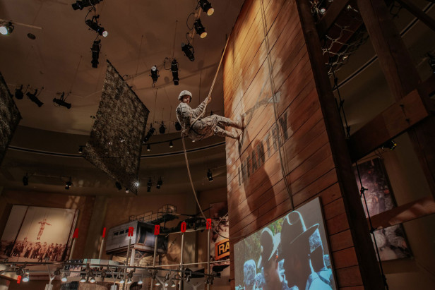 Exhibit showing a rappelling soldier
