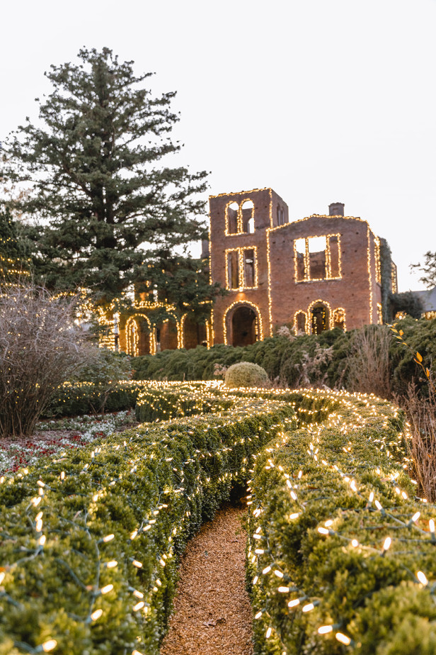 Holiday lights outside a historic resort in the background.