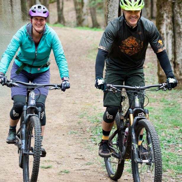 couple biking on a path
