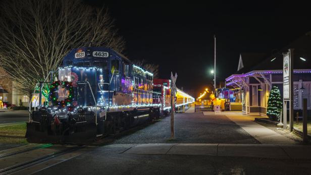 A train glowing with Christmas lights