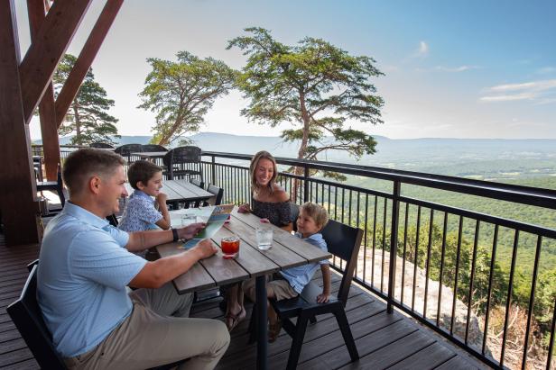 Family dining on a patio at Cloudland at McLemore Resort Lookout Mountain