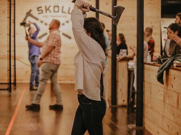 Axe throwers at Skoll Axe Throwing