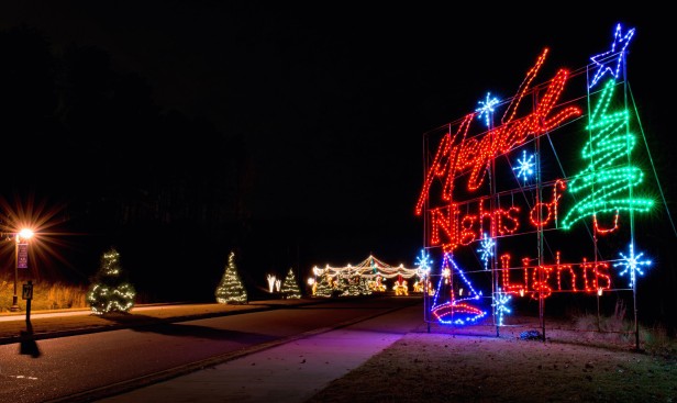 Holiday light displays line the road at Magical Nights of Lights at Lanier Islands Resort in Buford, Georgia