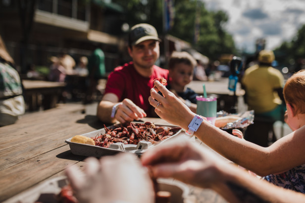 People eating crawfish at the Bon Temps Crawfish Festival in Dublin, Georgia