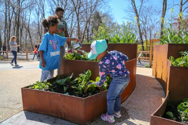 Children watering plants at the State Botanical Garden of Georgia in Athens