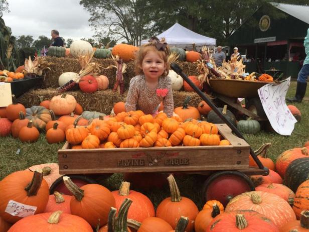 Kids and pumpkins at the Cotton Fair in Gay, Georgia
