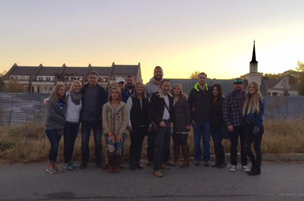 Fans pose in front of Alexandria on a tour with Georgia Tour Company in Senoia, Georgia