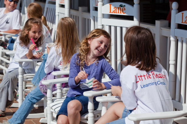 Kids eating ice cream on a porch