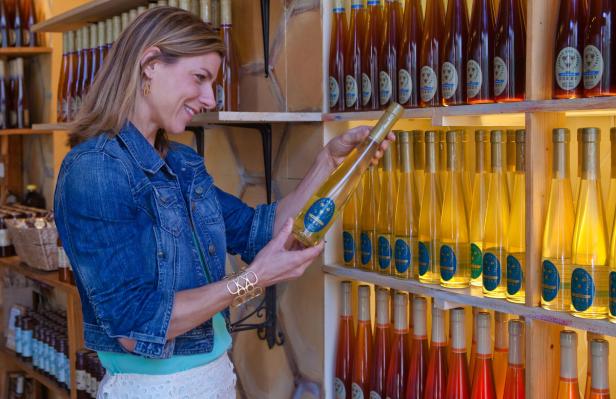Woman shopping for honey at Savannah Bee Company in Savannah