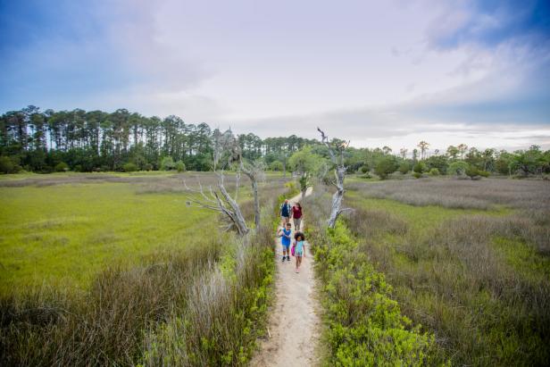 Family on trail at Skidaway Island State Park in Savannah, Georgia