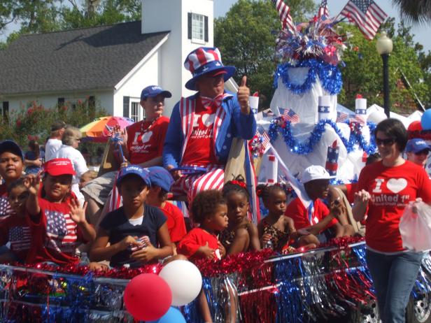 People celebrate at a July 4th festival