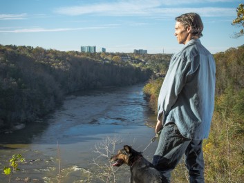 Man and his dog overlook the Chattahoochee River