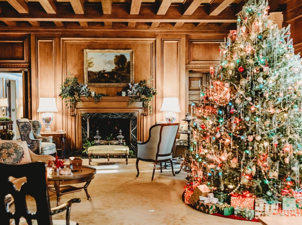 The living room decorated for Christmas, featuring a 1940s era live Fraser fir Christmas tree.