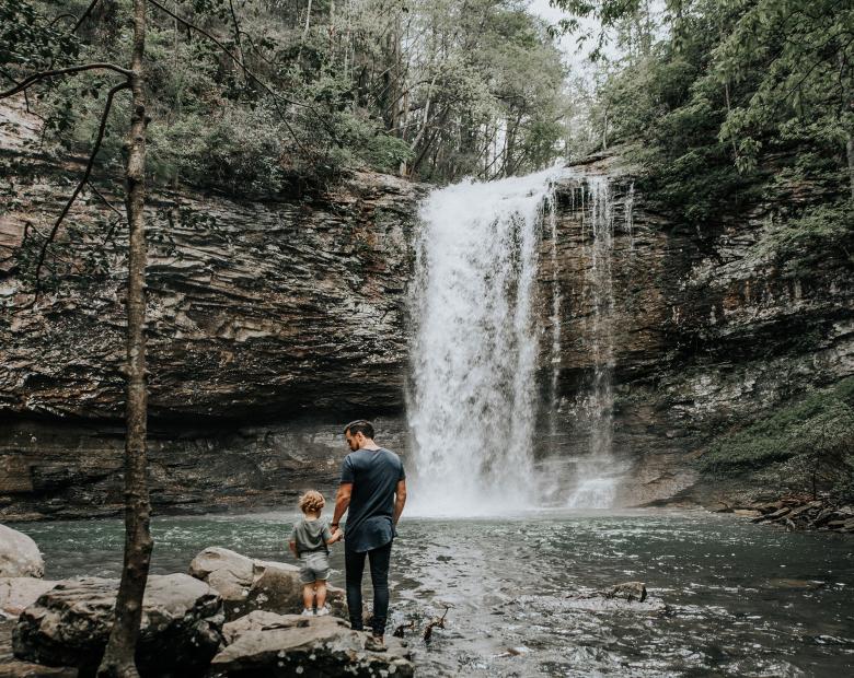 Father and son at Cloudland Canyon waterfall in Rising Fawn, Georgia.