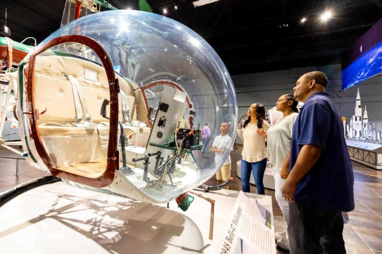 Family at a helicopter exhibit at Tellus Science Museum in Cartersville, Georgia
