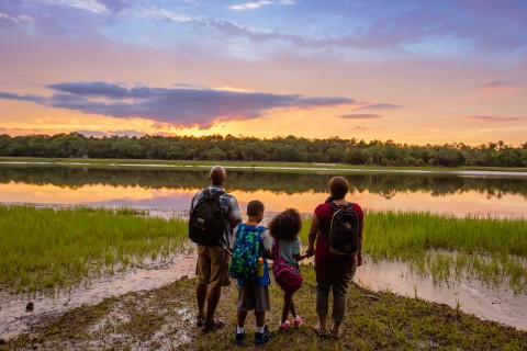 Family watching the sunset over the marsh at Skidaway Island State Park