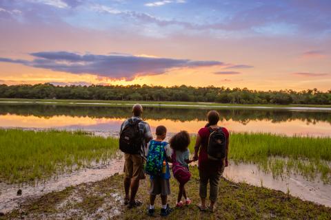 Family watching the sunset over the marsh at Skidaway Island State Park