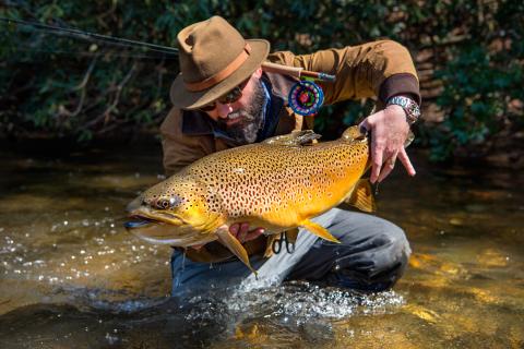 Will Taylor, fishing guide and owner of Fly Shop Co. of Blue Ridge, Georgia, shows off a trout. Photo by Jason Stemple