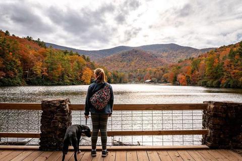 Girl hiking with dog in Georgia at Vogel State Park in Blairsville. Photo by @justindustin