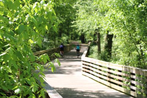Biking on a boardwalk in the Arabia Mountain National Heritage Area. Photo by Jason Meucci