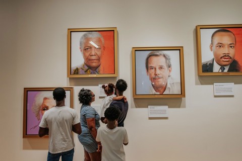 Family looking at portraits at the National Center for Civil and Human Rights in Atlanta, Georgia