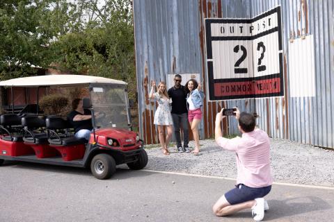 Three people posing for a photo in Senoia