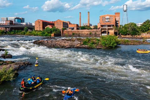 Rafters and kayakers on the river in Columbus, Georgia