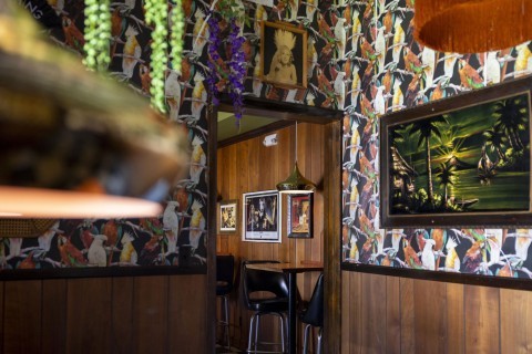 Tiki vibe interior of Lone Wolf Lounge in Savannah's Starland District