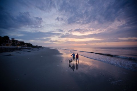 Couple walking on the beach at the King and Prince Resort on St. Simons Island, Georgia