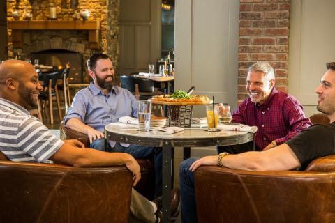 Four men dining at a Lake Oconee restaurant