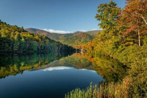 Mountain lake surrounded by colorful fall foliage