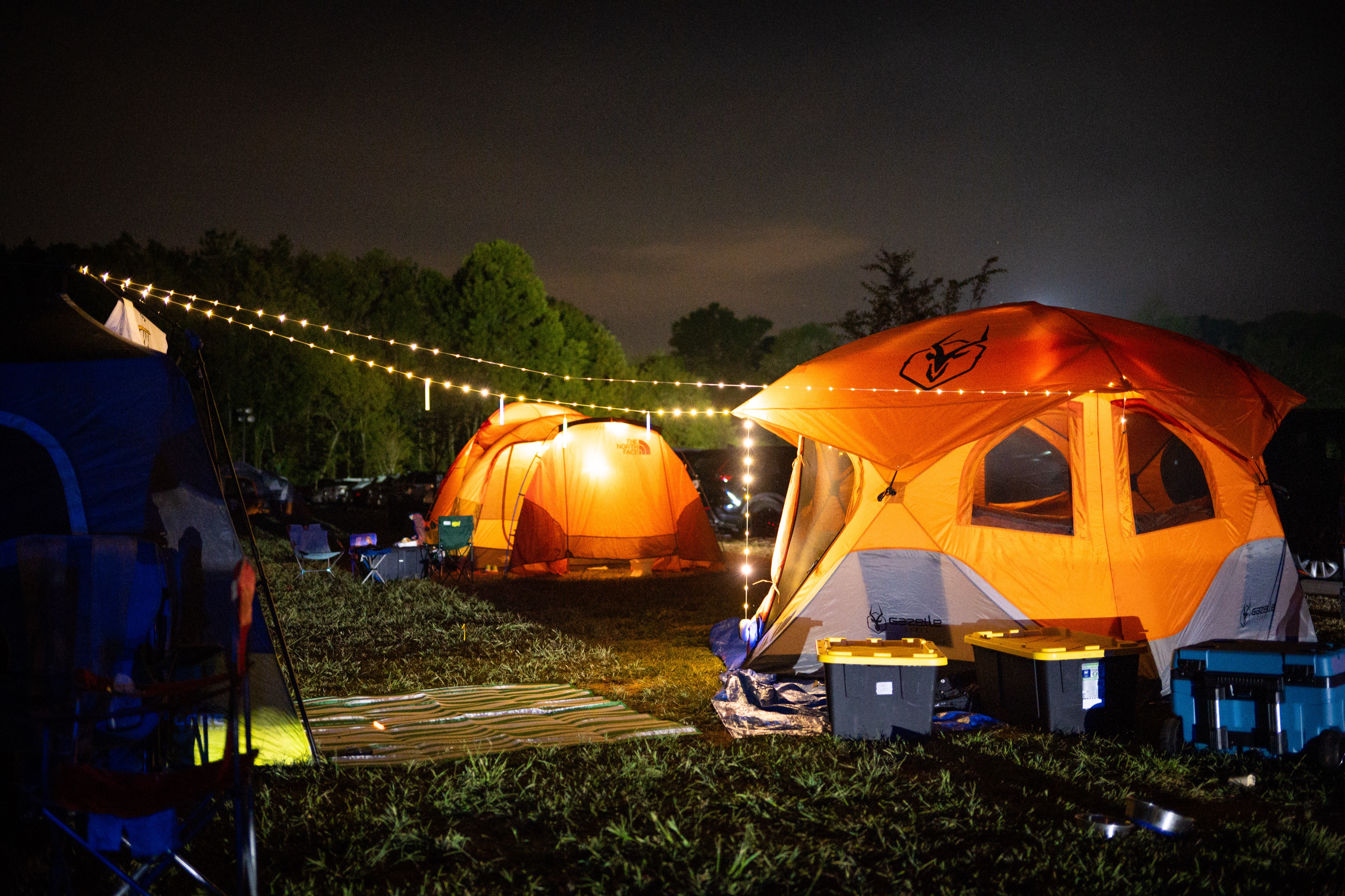 Yellow tent lit from inside at night