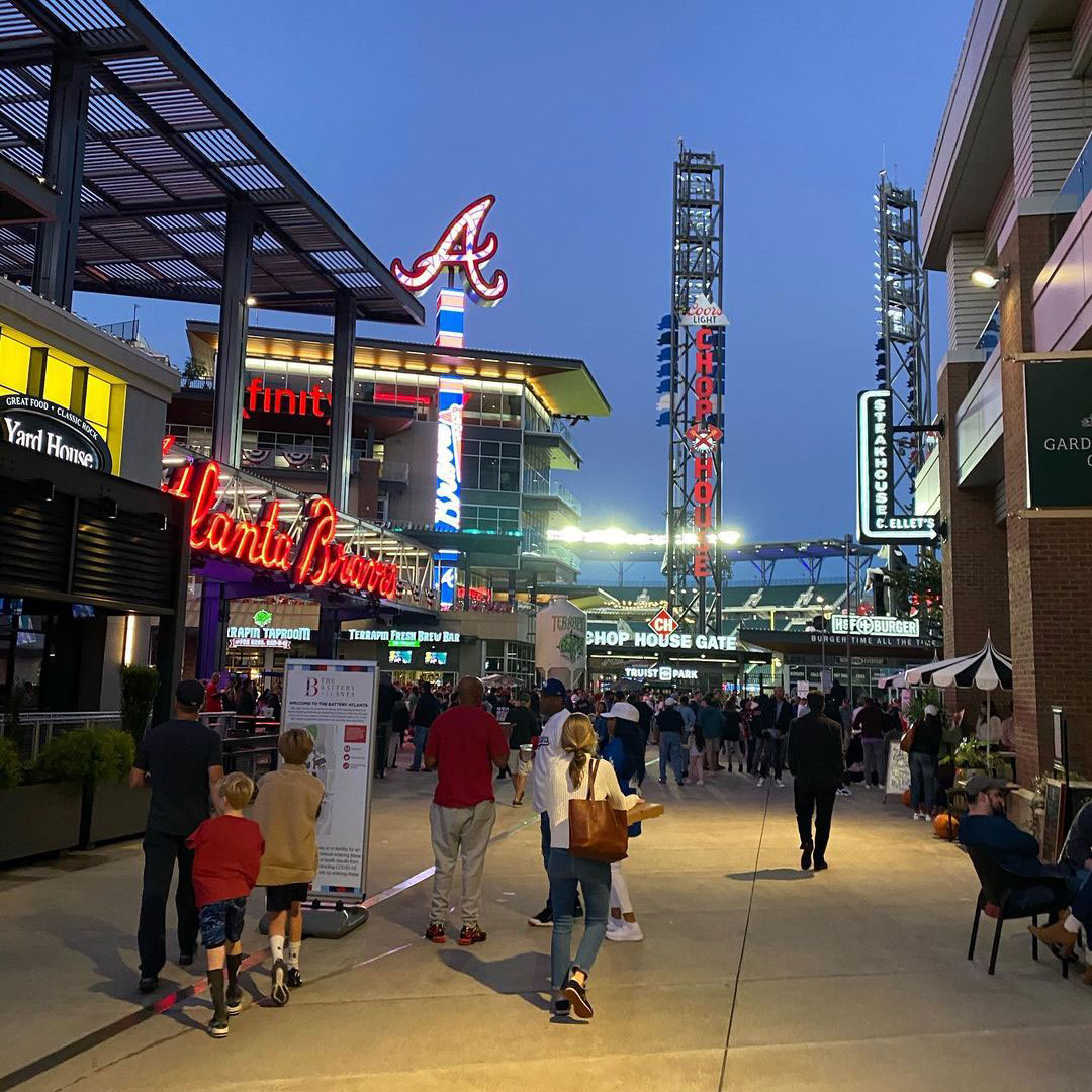 People walking near Truist Park at The Battery Atlanta at night