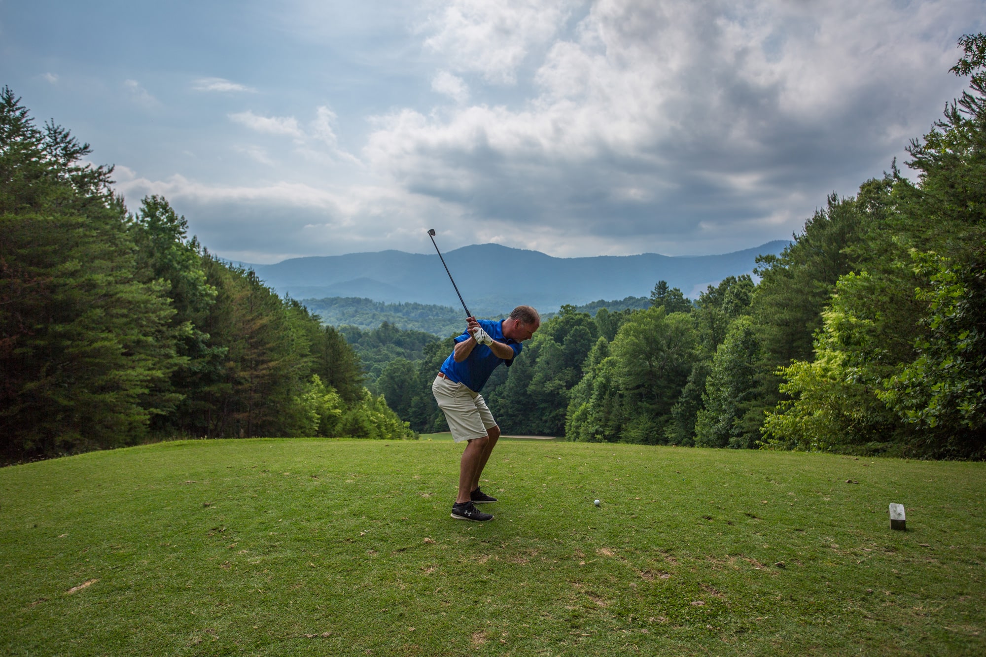 A golfer tees off at Whitepath Golf Course in Ellijay, Georgia